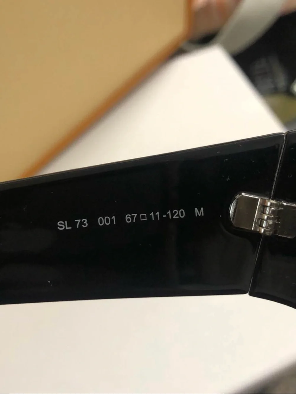 Yves Saint Laurent Black Women's Oval Sunglasses with Dark Lenses